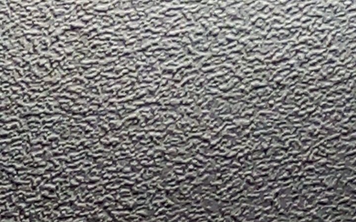 Close-up of a sprayed popcorn ceiling texture